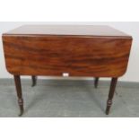 A good William IV Cuban mahogany Pembroke table, with reeded edge and blind drawers to either