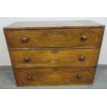 An early 19th century country made elm chest of excellent colour and patina, housing three long