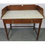 An Edwardian mahogany marble topped washstand with ¾ gallery, above two short drawers with pressed
