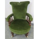 A Victorian mahogany scroll back open-sided armchair, with turned and beaded spindles, upholstered