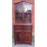 A fine Regency Period tall library secretaire bookcase, the astral glazed doors opening onto two