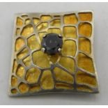A black diamond set in white metal gilded square pendant, approx 25mm across, approx 0.75cts with