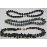 A labradorite necklace with apatite spacers and white metal ball clasp, a blue goldstone necklace