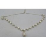An attractive pearl & 925 silver necklace, with 2cm long baroque principal pearl and 22mm x 7mmm