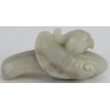 A Chinese carved pale celadon Jade Phoenix, Ming style but likely Qing, 8cm long x 4cm high.