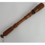 A 19th century turned box wood articulated truncheon/cosh, probably Naval press gang, length 42cm.