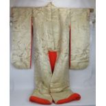 A vintage Japanese silk wedding Kimono, the body being gold threaded with bird pattern fabric, red