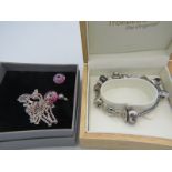 A decorative trollbead bracelet having 13 different metal & glass bead/charms marked Love Links