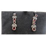 A pair of silver, garnet & marcasite drop earrings, 3cm drop, in branded Azendi box. Condition