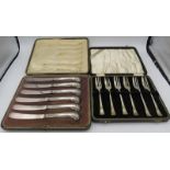 A set of silver cake forks. Sheffield 1938. Boxed. Also a set of 6 silver pistol handled dessert