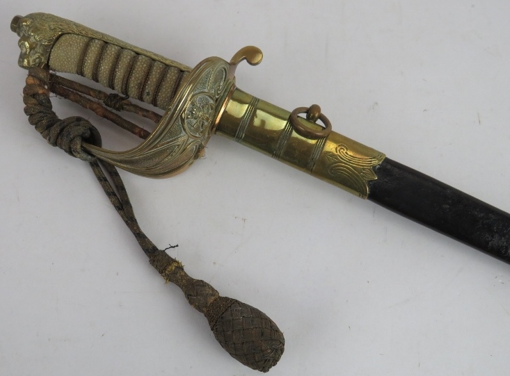 A Royal Naval Officer's sword by R C James & Co, Portsmouth. Brass hilt with shagreen grip and