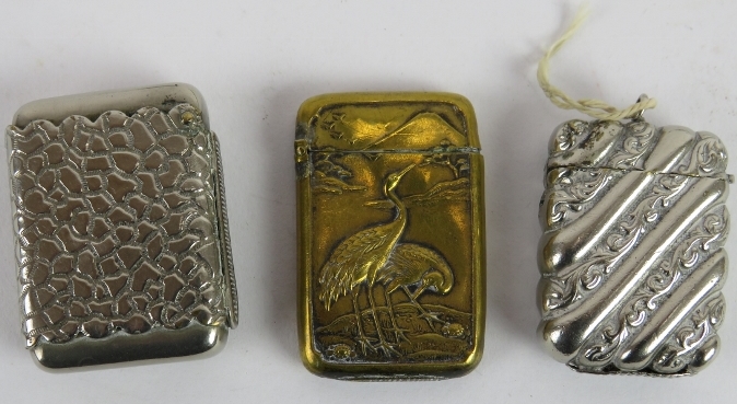 Six mixed vesta cases including one brass Japanese example, and a silver plated cigarette case. (7). - Image 3 of 3