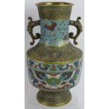 An antique Chinese bronze vase with Champleve enamel decoration and dragon head handles. Height: