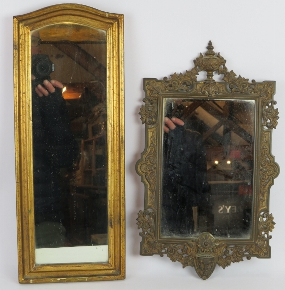 A gilt framed vintage wall mirror with some foxing. 52cm x 20cm, and an ornate Victorian gilt