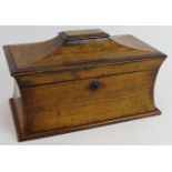 A 19th century Rosewood Sarcophagus shaped tea caddy. Partially internally fitted. Length: 34.5cm,
