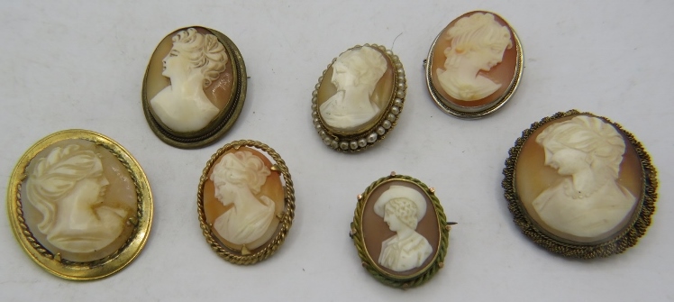 A collection of 7 mainly vintage Cameo brooches/pendants, to include one with seed pearls. Condition