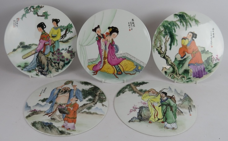 Five hand decorated Chinese porcelain plaques depicting various traditional scenes. Diameter: