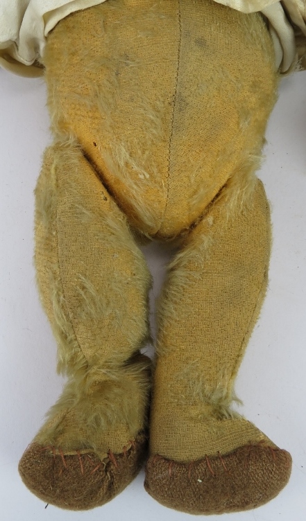 An early 20th century jointed Teddy Bear with growler in a silk nightdress and a handmade black - Image 3 of 4