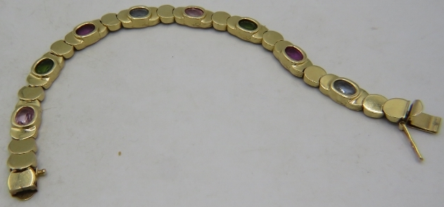 A 14ct yellow gold bracelet set with semi precious stones. 22 grams. Condition report: Good