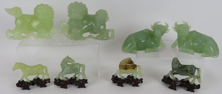 A pair of Chinese carved Jade/Jadeite Dogs of Fo. A similar pair of carved water buffalo and four