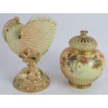 A Royal Worcester blush nautilus shell with lizard, date marked 1895, and a Royal Worcester