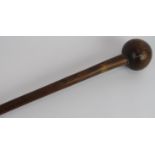 An antique carved wood African knobkerrie club, possibly of Zulu origin. Carved number to head '