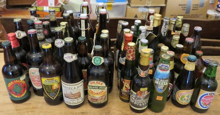 A collection of vintage British and World beers 1970s-1990s, including many in 1 pint bottles.