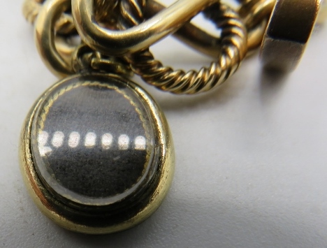 A 9ct yellow gold chunky link bracelet with 9ct gold padlock and 2 other chains. 36.8 grams. - Image 3 of 4