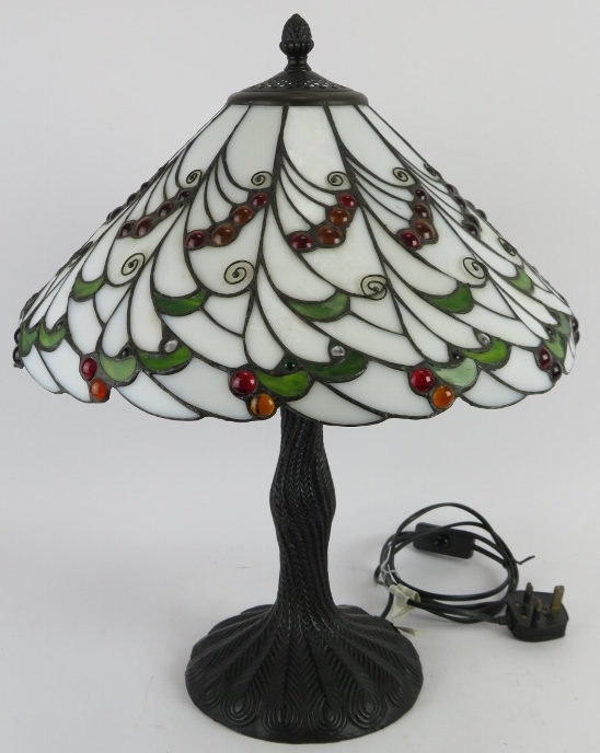 A Tiffany style table lamp by Loxton Lighting with jewelled glass shade of berry and leaf pattern,