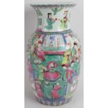 A 20th century Chinese porcelain baluster vase hand decorated in Famille Rose style. Height: 36cm.