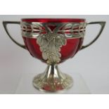 An early 20th century WMF silver plated two handled bowl with Cranberry glass liner and mistletoe