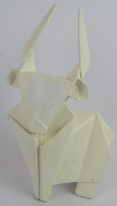 A stylised Origami like cubist model of a bull of composite construction. Height 38cm. Width 23cm.