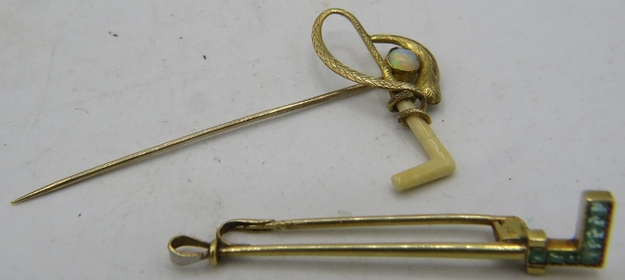 An 18ct yellow gold Art Deco bar brooch set with 7 emeralds and a yellow metal stick pin in the