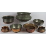 Seven Indo-Persian copper bowls of varying size and shape, mostly silvered and with engraved