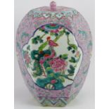 A large Chinese porcelain covered jar with enamelled decoration and cartouche depictions of birds.
