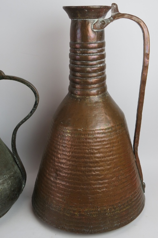 Two large beaten copper Middle Eastern water ewers and a large dallah coffee pot with detachable li - Image 2 of 5