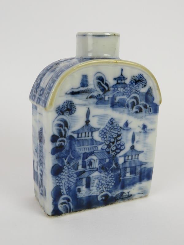 A small 18th century Chinese porcelain tea caddy with blue and white decoration, arched shoulders