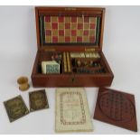 A late 19th century F. H. Ayres Games Compenium in fitted mahogany case. Games including Chess,