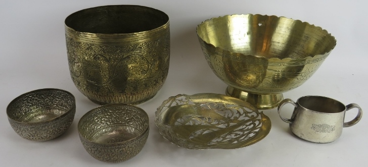 A finely decorated Indo-Persian brass Jardinière, two repousséd Eastern bowls, a turned brass