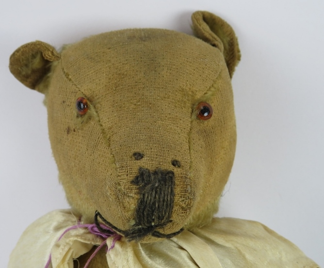 An early 20th century jointed Teddy Bear with growler in a silk nightdress and a handmade black - Image 4 of 4