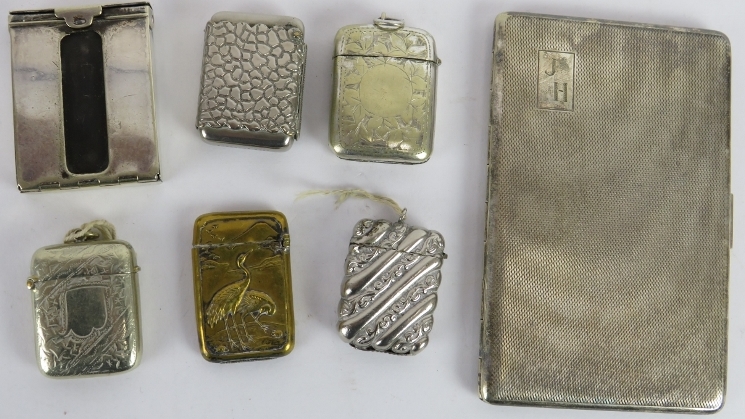 Six mixed vesta cases including one brass Japanese example, and a silver plated cigarette case. (7).