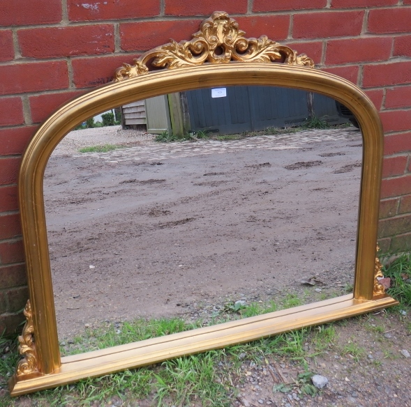 A 19th century style arched overmantel mirror in a gilt frame with moulded cornice and corner detail - Image 2 of 2