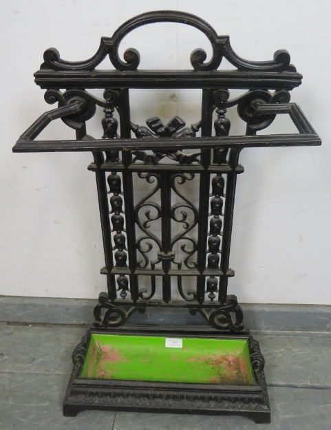 A 19th century cast iron stick stand in the manner of Coalbrookdale, with removable drip tray.