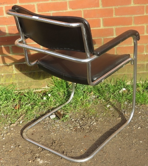 A vintage mid century cantilever chrome framed desk chair upholstered in a black vinyl material. - Image 3 of 3