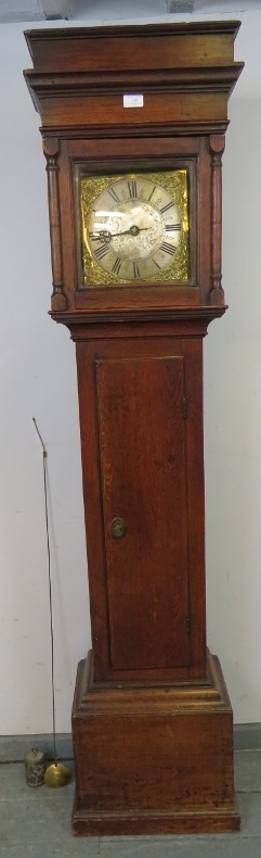 An early 18th century oak-cased longcase clock of small proportions, the plain hood with stepped