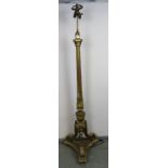 An ornate vintage gilt gesso standard lamp in the 18th century Italian taste, the reeded tapering