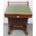 A fine Victorian rosewood Davenport, the ¾ gallery with turned spindles, surrounding a blind inkwell