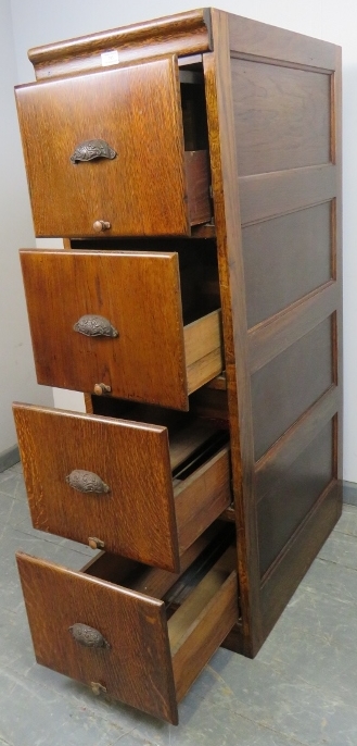 An early 20th century oak filing cabinet with fielded side panels, housing four drawers with cast - Image 3 of 3