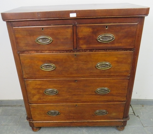 A Victorian mahogany chest of two short over three long graduated drawers with pressed brass