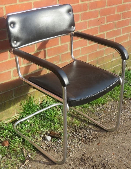 A vintage mid century cantilever chrome framed desk chair upholstered in a black vinyl material. - Image 2 of 3